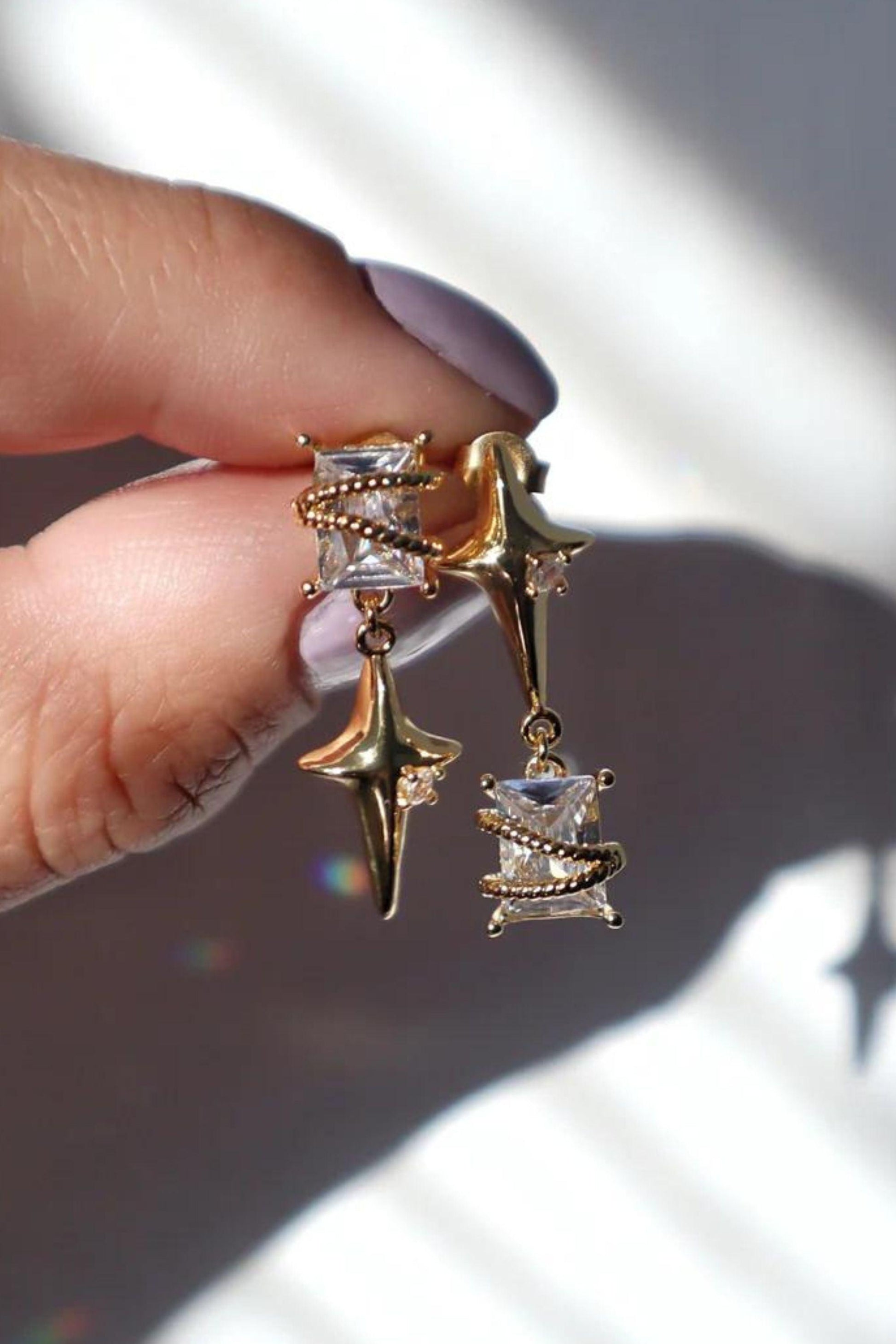 asymmetric star gold dangle earrings